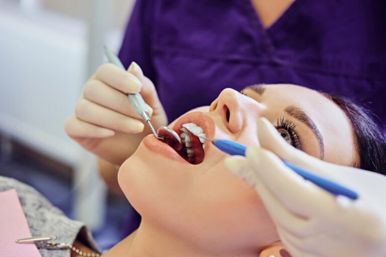 close-up-image-dentist-examining-female-s-teeth-dentistry