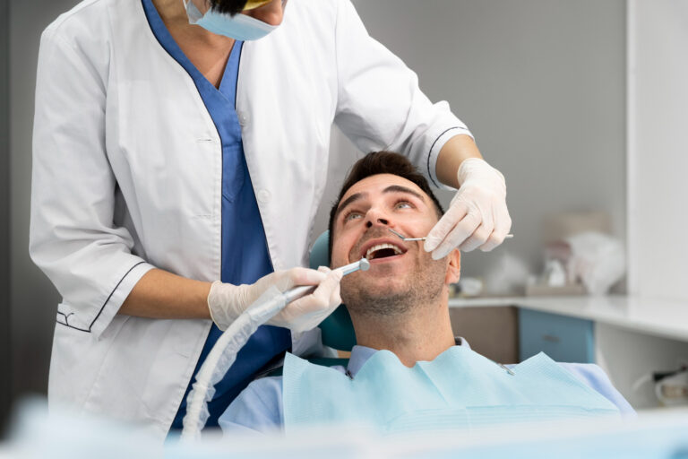 Dental professional treating a patient in a dental clinic